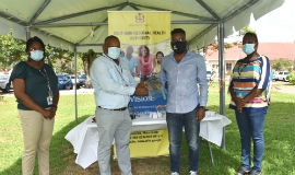 Regional Director for the Southern Regional Health Authority (SRHA), Michael Bent (2nd left) receives a donation of 900 face shields from Co-Founder of Citizens Response Jamaica, Larren Peart on Friday, July 10. Participating in the handover were: Director of Public Procurement at the SRHA, Stacey-Ann Edwards (right) and SRHA Regional Non-Communicable Diseases Coordinator, Dr. Yasine Hanna. 