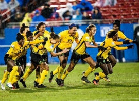Members of Jamaica National Women's Football Team celebrate after securing a spot at the World Cup in France, scheduled for June 7 to July 7, 2019. The team will make a stop in South Florida before heading to Europe   