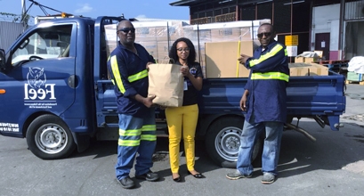 Nadine Jardine, Caribbean Airlines Cargo Operations Manager POS & Southern Caribbean receives donated relief supplies from Kevin Williams and Christian George of The Foundation for the Enhancement and Enrichment of Life (FEEL). The donated supplies will be airlifted to Nassau, Bahamas via Caribbean Airlines scheduled service on Sunday 8 September.