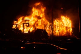 A 190 unit affordable housing complex that was under construction burns after it was set on fire during a riot over the police killing of George Floyd in Minneapolis on May 28, 2020. (Chris Juhn/Zenger)
