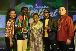 The Minister of Culture, Gender Entertainment and Sport, Honourable Olivia Grange (centre) and Chairman of the Jamaica Festival Song Committee, Orville Hill (far right) stand proudly with the top three winners of the 2020 Jamaica Festival Song Competition at the Competition’s Grand Final in July. The winners are Jamaican Reggae icon Buju Banton (left) who won the competition with his entry I am a Jamaican, Dancehall and Reggae veteran Papa Michigan (right) who placed second with Jamaica Dance and actress and musical newcomer and one of the competition’s only two female finalists Sakina Deer, who placed third with We are Jamaica. The competition took on a virtual edge this year due to challenges raised by the Covid-19 Pandemic.