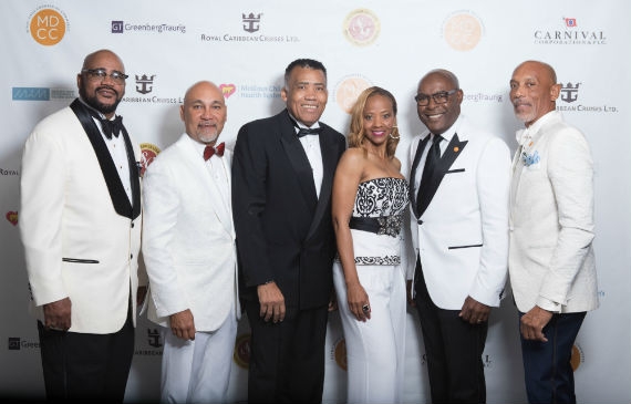 Miami-Dade Chamber of Commerce Board Members stop for a picture at their 13th Annual Holiday Gala. Pictured from left to rightare Board Treasurer Wayne Davis, Board Parliamentarian Robert Holland, Board Member Al West, Board Secretary Shelia Powel Cohen, Board Vice Chairman Jeff Lozama and President & CEO G. Eric Knowles.