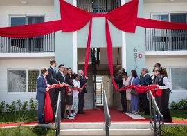 Chairwoman Edmonson join federal, state and local officials and developers in unfurling the ribbon on the project.  (Photos by Ryan Holloway / Miami-Dade County)