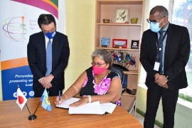 Japan’s ambassador to Trinidad and Tobago, Tatsuo Hirayama, and CARPHA executive director, Dr. Joy St. John, and Dr. Mark Sami, Director of Corporate Services, CARPHA at signing ceremony (Photo credit: CARPHA/Joseph Charles)