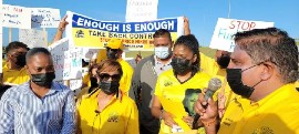 Kamla Persad-Bissessar joins UNC supporters in protesting fuel price increase.