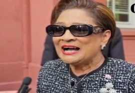 Prime Minister Kamla Persad Bissessar speaking to reporters outside Parliament on Friday (CMC Photo)
