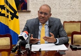Foreign Affairs and Foreign Trade Minister, Kerrie Symmonds, speaking at the news conference on Monday (BGIS Photo).