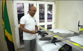 United Nations Development Programme (UNDP) Resident Representative Dr Kishan Khoday inspects the new fixed wing Vertical Take Off and Landing (VTOL) Drone.
