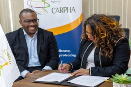 CARPHA’s executive director, Dr. Lisa Indar, signing the framework agreement during the virtual ceremony (CARPHA Photo)