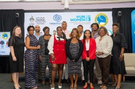 Maria Ziegler, Senior Gender Specialist, Caribbean Development Bank (left), Dr. Tonya Haynes, Head and Lecturer, Institute for Gender and Development Studies: Nita Barrow Unit, The University of the West Indies – Cave Hill (second from left) and Ms. Sharon Carter-Burke, Communications and Advocacy Analyst, UN Women Multi-Country Office – Caribbean (second from right) join youth advocates at Caribbean Futures High-Level Anti-Violence Forum. (Photo credit: University of the West Indies, Cave Hill)
