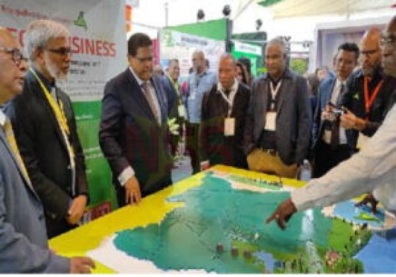 President Santokhi being shown a map of future oil fields in Suriname at the SEOGS