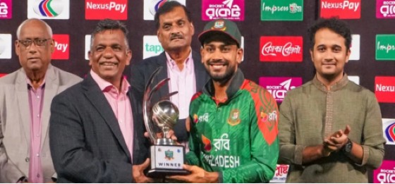Bangladesh captain Mehidy Hasan Miraz (second right) accepts the winners’ trophy after they defeated the West Indies in the third and final ODI.