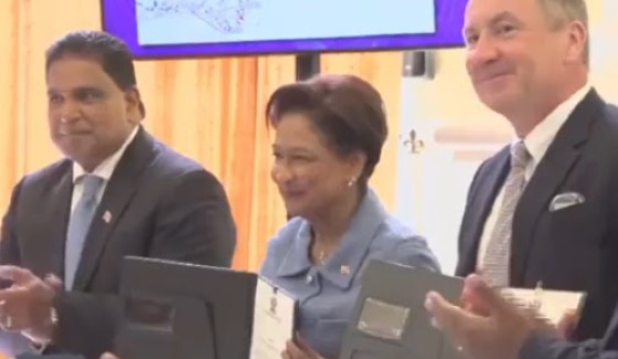 Energy Minister Dr. Roodal Moonilal (left) Prime Minister Kamla Persad Bissessar and Vice President of Global Exploration at ExxonMobil Upstream Company, John Ardill, after signing the agreement (CMC Photo)