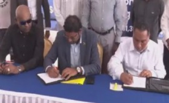 Representatives of the Trinidad-headquartered NAMALCO and GuyAmerica construction sign the US$161 million contract for the reconstruction of the new Soesdyke-Linden Highway
