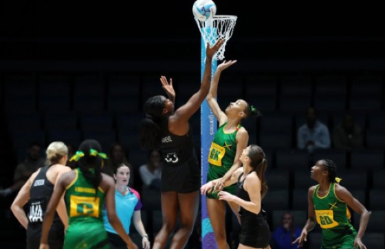 Grace Nweke of New Zealand (third left) jumps for a rebound against Jamaica. (Getty Images)