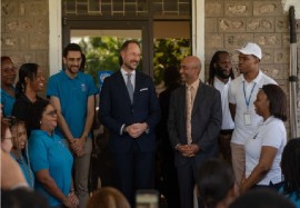 Norway’s Crown Prince, Haakon Magnus, who is also a UNDP Goodwill Ambassador, with staff members at the UNDP office in Jamaica