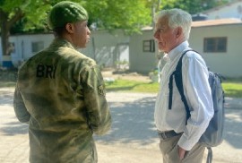 William O’Neill (right), the UN’s designated expert on the human rights situation in Haiti talks to a Haitian police officer in Port-au-Prince (Photo OHCHR/Marion Mondain)