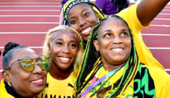 Minister of Culture, Gender, Entertainment and Sport, Olivia Grange (left) and ‘Team Jamaica’ supporters, share a moment with Shelly-Ann Fraser-Pryce (second left), following her victory in the women’s 100-metre event at the 2022 World Athletics Championships in Eugene, Oregon.