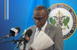 Prime Minister Phillip J Pierre reading the letter from the British government during the news conference on Monday (CMC Photo)