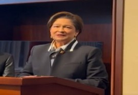 Prime Minister Kamla Persad Bissessar speaking to reporters on her return from the United States on Wednesday night (CMC Photo)