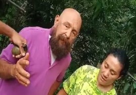 Screen shot shows husband and wife being held by abductors armed with guns and a grenade and demanding US$2.5 million ransom