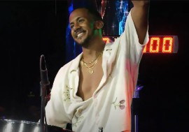 Joshua Regrello acknowledges supporters after playing the steelpan for 31 hours. (CMC Photo)