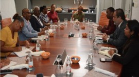 Barbados’ Minister of Tourism, Ian Gooding-Edghill (second from left), and Trinidad and Tobago’s Minister of Civil Aviation and Transport, Eli Zakour (second from right) in discussion on future cooperation. Also present at the meeting were several tourism and civil aviation officials. (BGIS Photo)