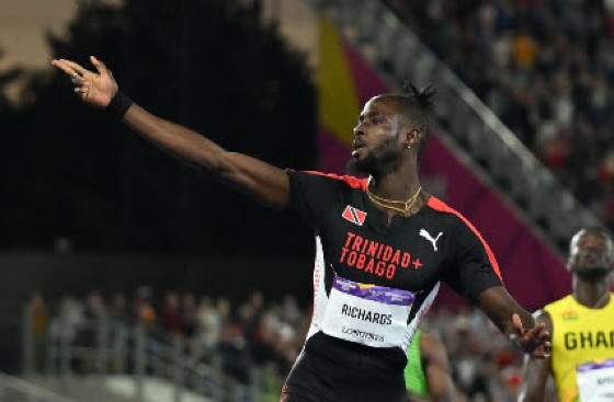 Trinidadian Jereem Richards celebrates after crossing the finish on Saturday.