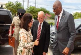 Governor General Sir Rodney Williams, (right) greeted on his arrival at the ceremony