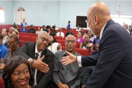 ir Ronald Sanders greeting Caribbean media workers at the funeral service of the late Rickey Singh at the Peoples Cathedral in Barbados on Wednesday (Photo courtesy Wesley Gibbings)