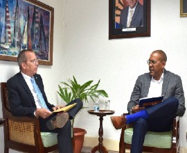 Simon Springett and Minister of Foreign Affairs and Foreign Trade of Barbados, Kerrie Symmonds.