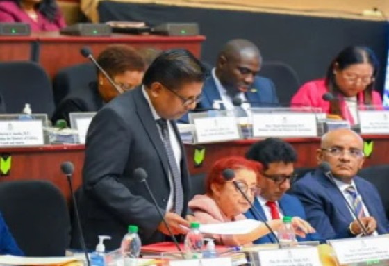 Finance Minister Dr. Ashni Singh tabling the economic mid year report during the first sitting of Parliament on Monday.