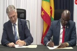 Health Minister Phillip Telesford and Dr. Szabi Dorotovics, President of Mount Sinai International signing the agreement on Wednesday (CMC Photo).