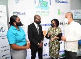 JN Foundation general manager, Claudine Allen (second right), in conversation with Housing, Urban Renewal, Environment and Climate Changes Minister, Pearnel Charles at the media launch of the summit