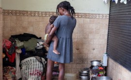 A woman says she was raped while fleeing from gang violence with her six children and while she was four months pregnant. (UNFPA/Wendy Desert photo)